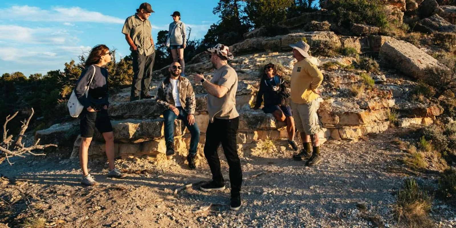 Guided group pausing on a South Rim trail during the Hummer add-on